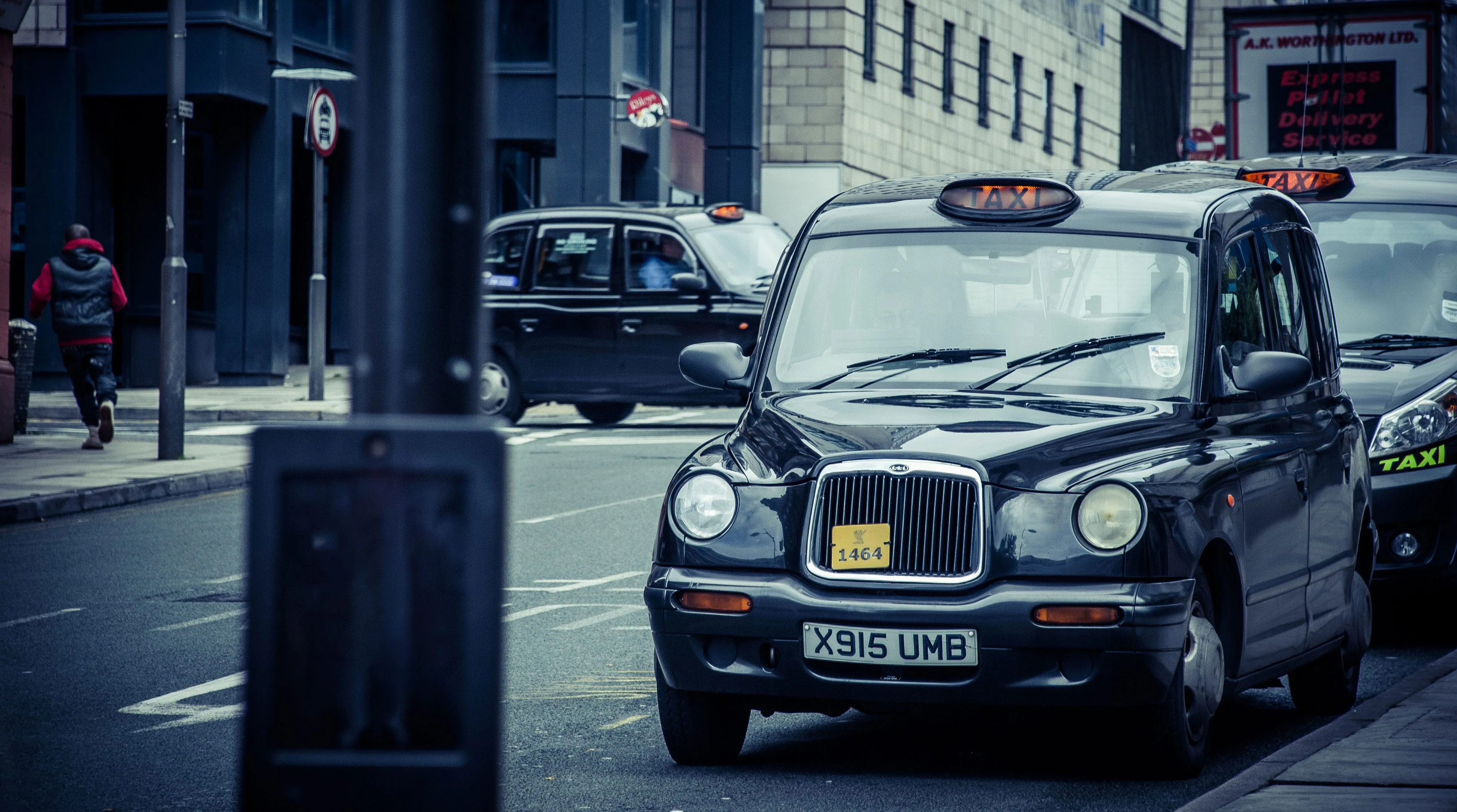 Black London taxi cabs queueing in a city street