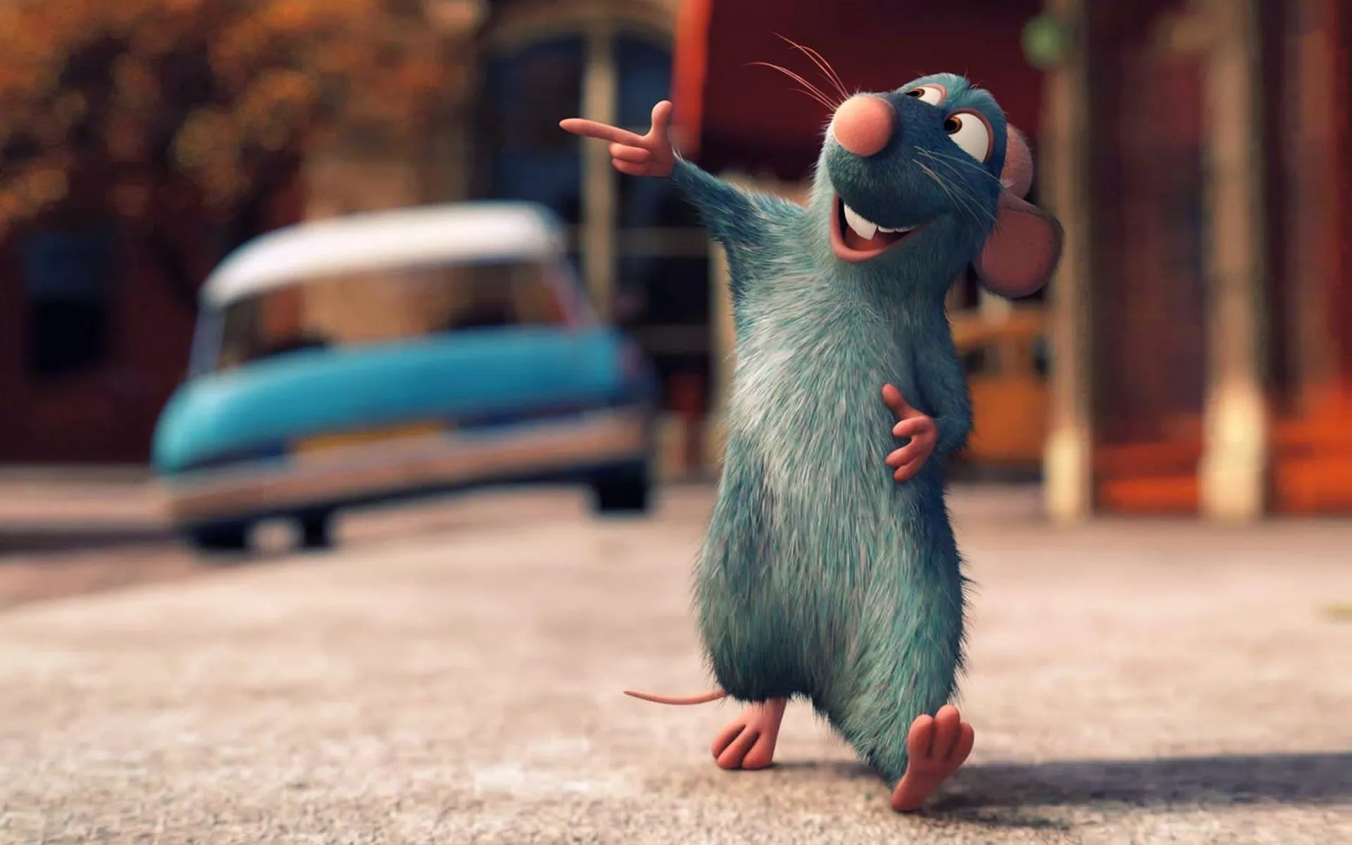 Remy the rat from Ratatouille grinning and pointing on a street, a blurred blue car behind him