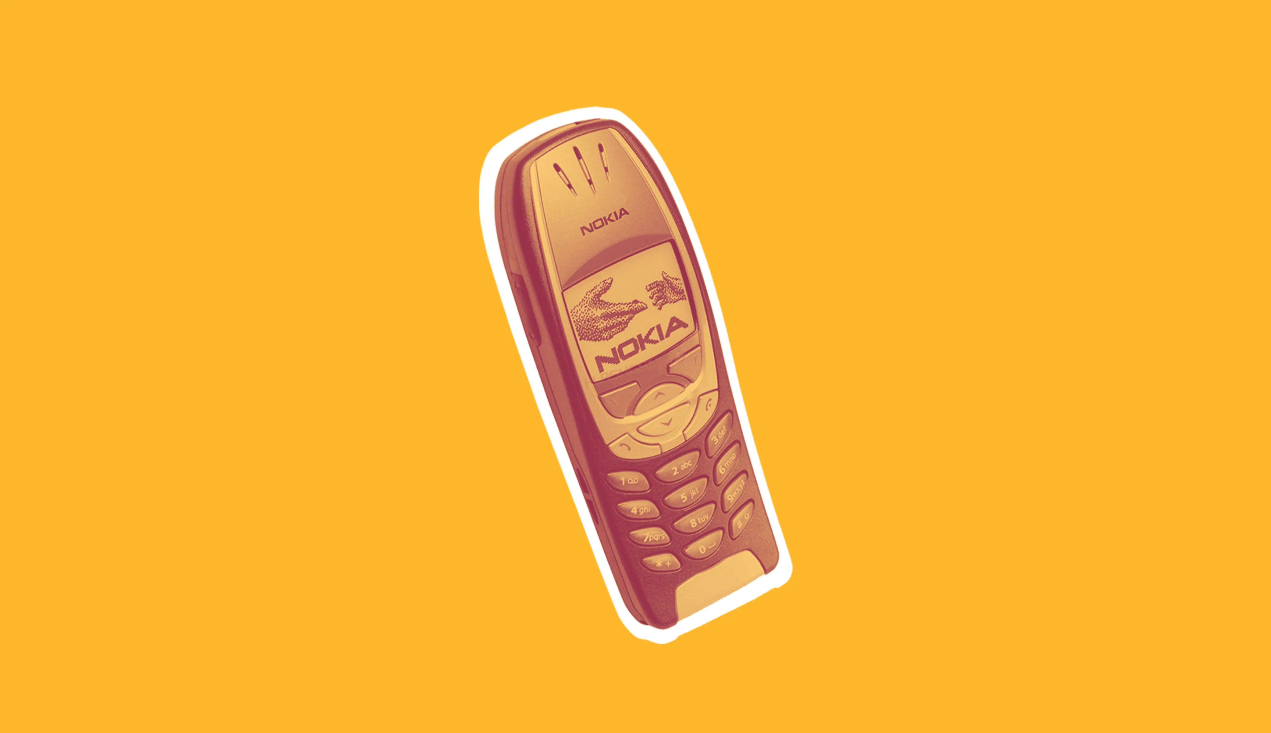 An old Nokia 6310 phone with a wood-pattern cover, cut out on yellow