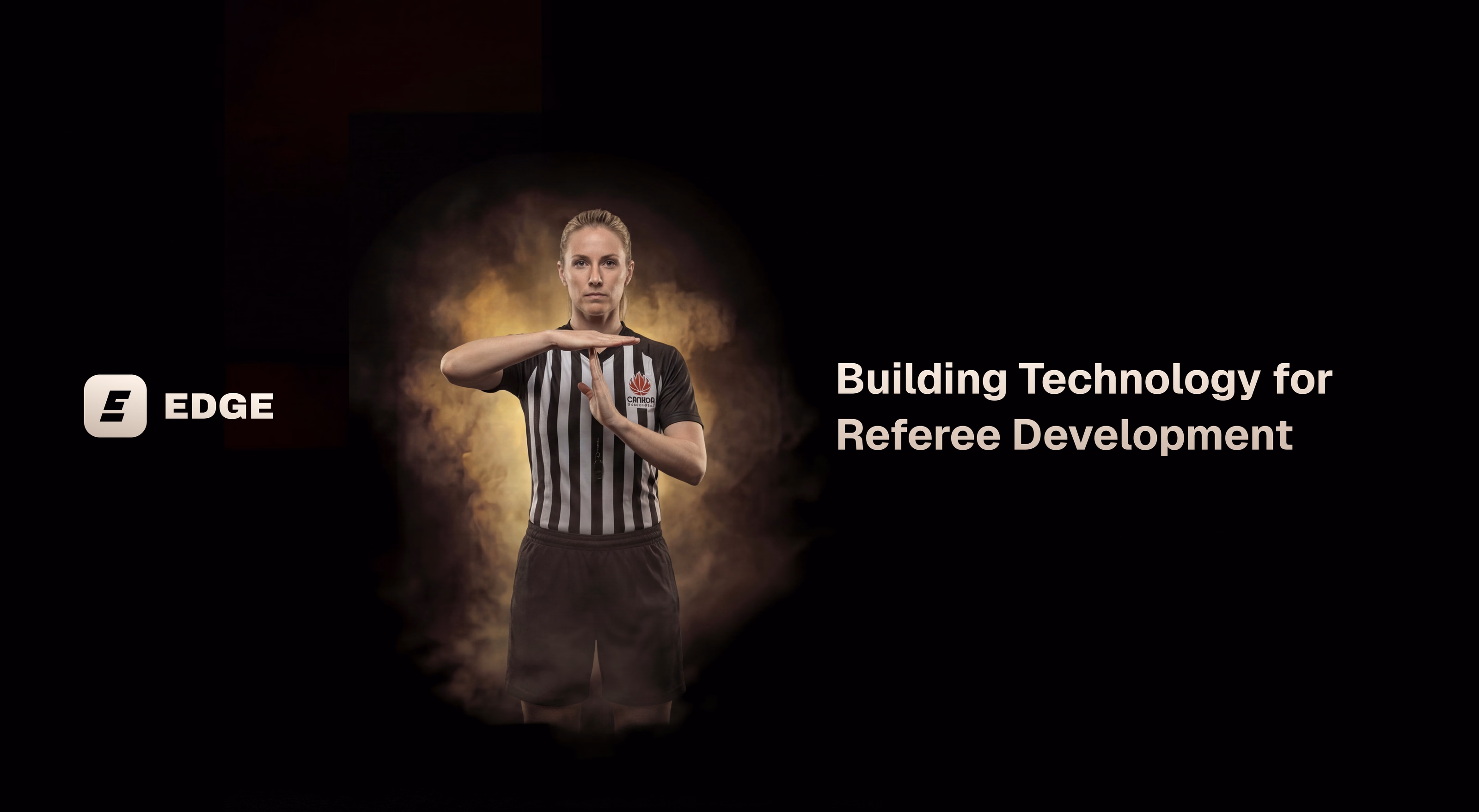 A referee mid-signal beside the EDGE logo and the line Building Technology for Referee Development